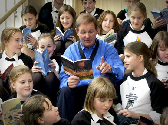 Michael Morpurgo reading to young people